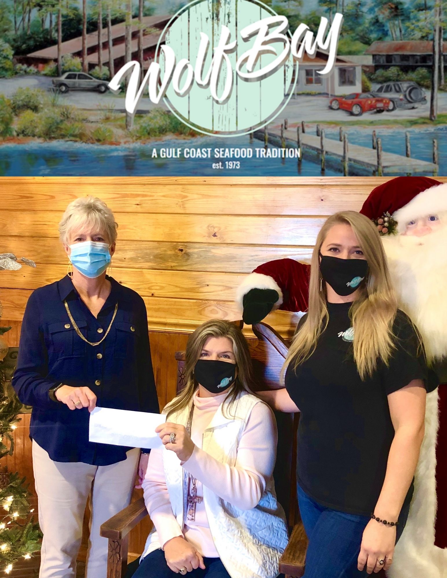 Pictured: Char Haber, Wolf Bay Restaurant Owner and SBCS Alumni (center), and Whitney Haber, Wolf Bay Manager (right), presenting a check to Dr. Kathy McCool, SBCS Principal (left).